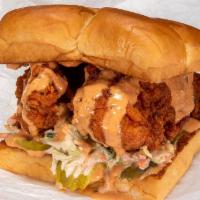 The Hot Chick · Beer-battered fried chicken, Nashville Hot style with secret sauce, slaw and pickles.