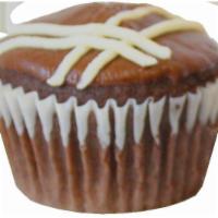 Filled Cupcake · Dark chocolate cupcake filled with non-dairy Vanilla cream and decorated with a simple desig...