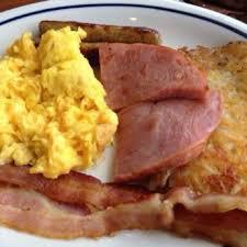 Breakfast Sampler · Fresh scrambled 2 eggs with 2 strips of (bacon, sausage or ham) with English muffin and hash browns.
