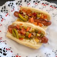 Chicago Style Hot Dog · All beef jumbo hot dog, mustard, relish, sport peppers, onion, tomatoes and celery salt on s...