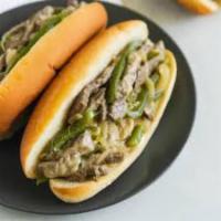 Philly Cheese Steak Combo · 100% trip-tip sirloin, sliced thin and chopped on the grill, served on a soft Italian roll w...
