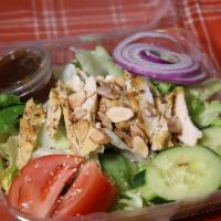 Asian Sesame Chicken Salad · Crisp lettuce, grilled chicken, tomatoes, cucumber, red peppers, carrots, red onions, roaste...