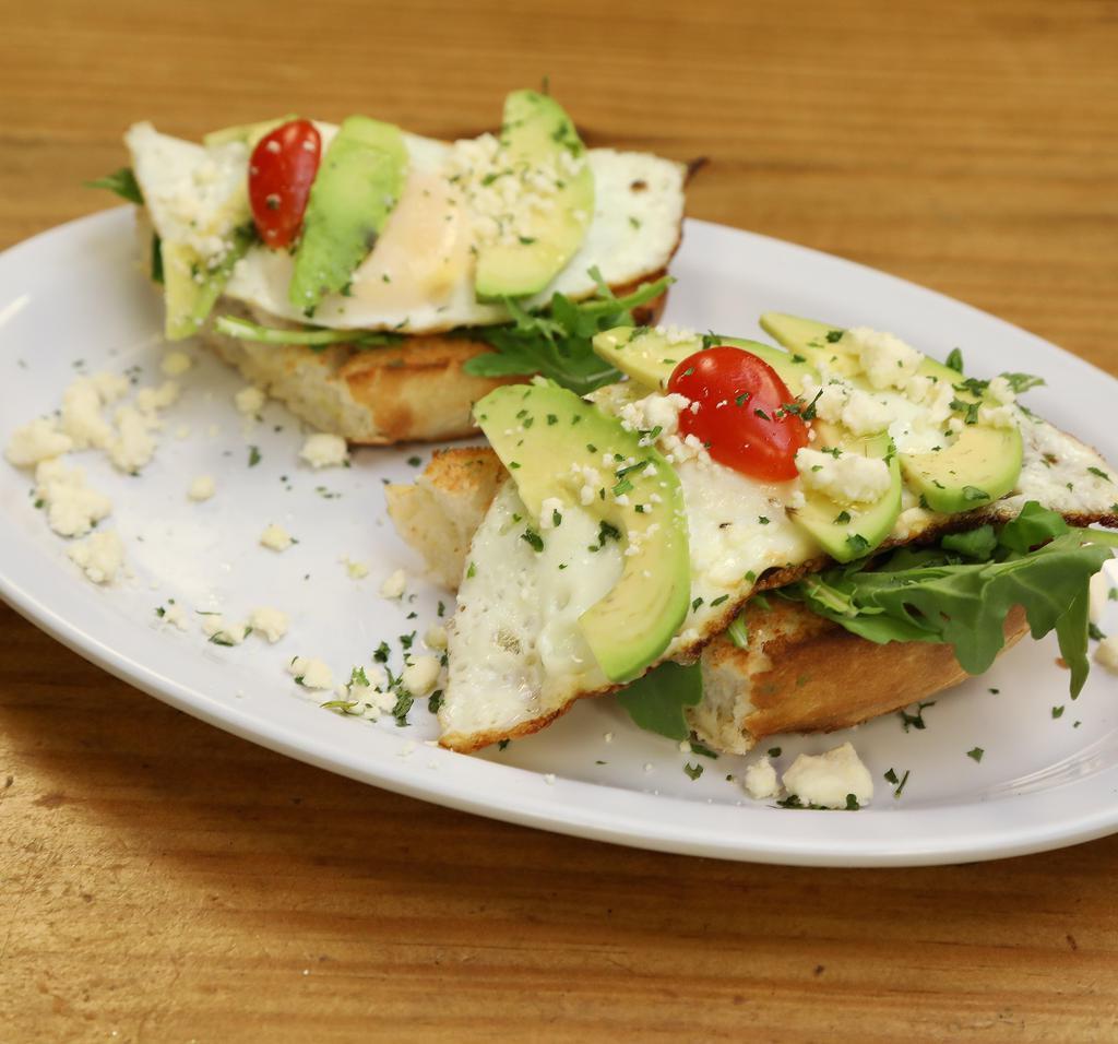 Fabio's Favorite · Fried egg, toasted baguette, spinach, avocado, feta cheese, cherries, tomatoes and pesto.