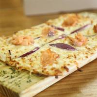 Salmon Pizza · Smoked salmon, red onion, cream cheese and mozzarella.
