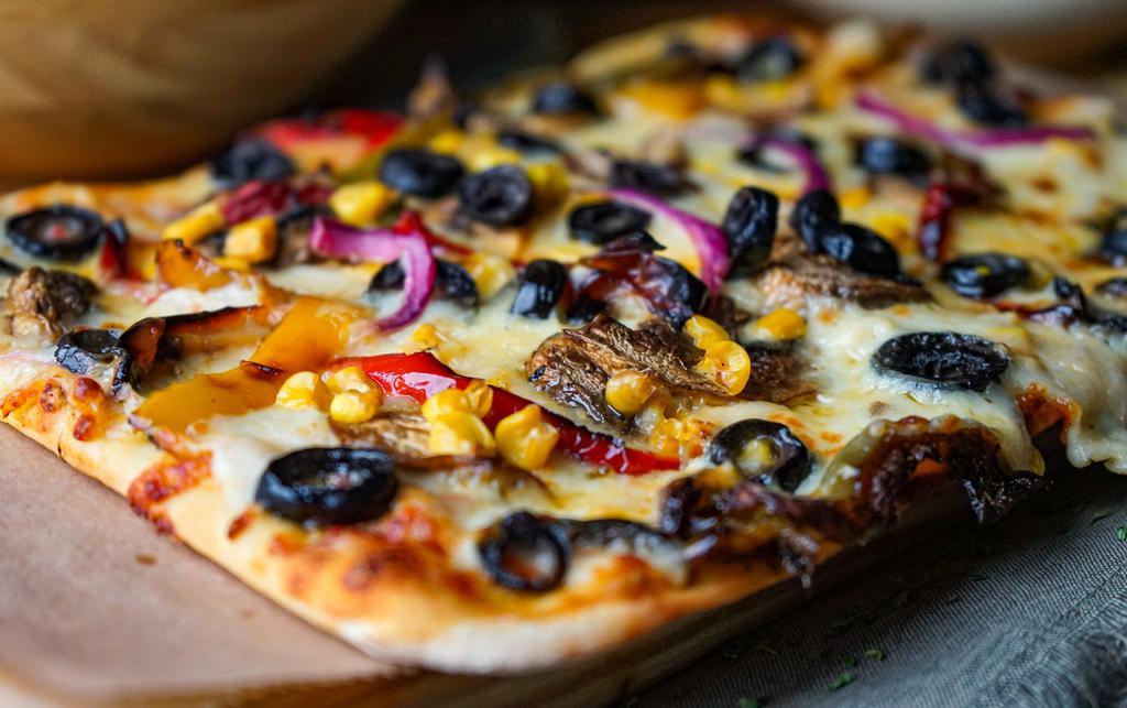 Veggie Pizza · Peppers, onions, corn, black olives, mushrooms, tomato sauce and mozzarella.