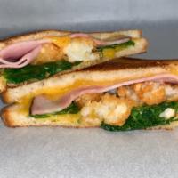 Not So Classic Melt · Sharp cheddar cheese with oven roasted ham, fresh spinach crushed tater tots on French bread.