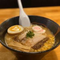 Negi Ramen · Spicy pork broth, topped with egg, chashu pork, bamboo shoots, and scallion.