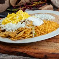 Chilaquiles · Rice, beans, salsa, cheese, 3 eggs and tortillas, option of green or red salsa.
