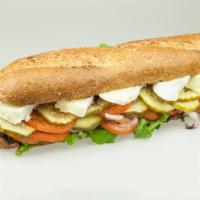 The Provencal Sandwich · Brie cheese on a bed of mixed greens with mayo, Dijon mustard, tomato, onions and dill pickl...