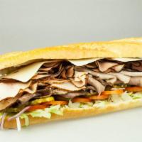 Monster Sandwich · Turkey, ham, roast beef and Swiss cheese on a french baguette with the mayo, mustard, lettuc...