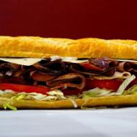 Half and Half Sandwich · Turkey and ham combo on a french baguette with Swiss cheese and mayo, mustard, lettuce, toma...