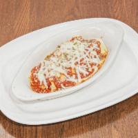 Manicotti · Ricotta Stuffed Manicotti Shells covered in tomato Basil sauce and melted Mozzarella
