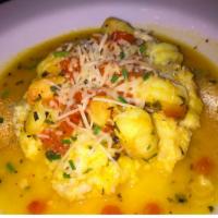 Specialty Shrimp and Grits · 6 jumbo shrimps sautéed in a tomato wine cream sauce over cold stone cheese grits.
