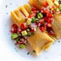 RED CHILI PORK BOWL · Two Red Pork Tamales served in a delicious bowl with rice, beans, and topped with, salsa, ch...