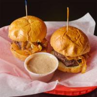 Filet Medallion Slider · 2 filet sliders topped with grilled onions. Served with choice of homemade chips, fries, cot...