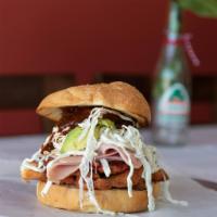 Atomic · Includes three meats Milanesa de pollo, Ham, and Carne Enchilda. *This does contain Pork*