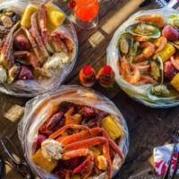 Family Deluxe Special · 1 lb. king crab legs, 1 lb. snow crab legs, 1 lb. shrimp (head-off), 1 lb. clams, 1 lb. craw...