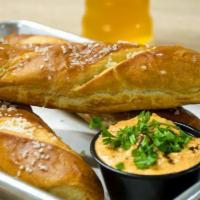 Bavarian Pretzels and Beer Cheese · Based off a European cheese spread recipe with a saucy twis. Contains anchovies. Add 2 pretz...