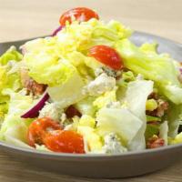 Chopped Salad · Iceberg, bacon, gorgonzola, egg, onion, tomato, blue cheese dressing.