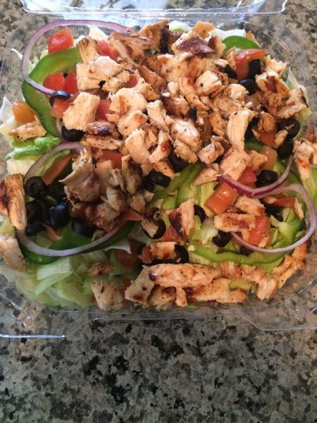 Grilled Chicken Salad · Iceberg lettuce, tomato, cucumber, onion, green pepper and black olives.