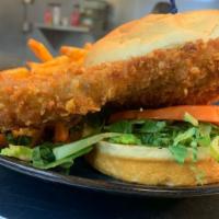Pork Tenderloin Sandwich · An Indiana favorite, hand-breaded deep-fried pork tenderloin topped with dill pickle chips o...