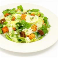 Caesar Salad · Romaine hearts, grated Parmesan cheese, shaved trio of Romano, Parmesan and Asiago cheeses a...