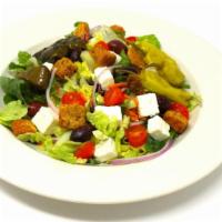 Greek Salad · Our house salad with feta, Kalamata olives, pepperoncini and stuffed grape leaves. small 1 d...