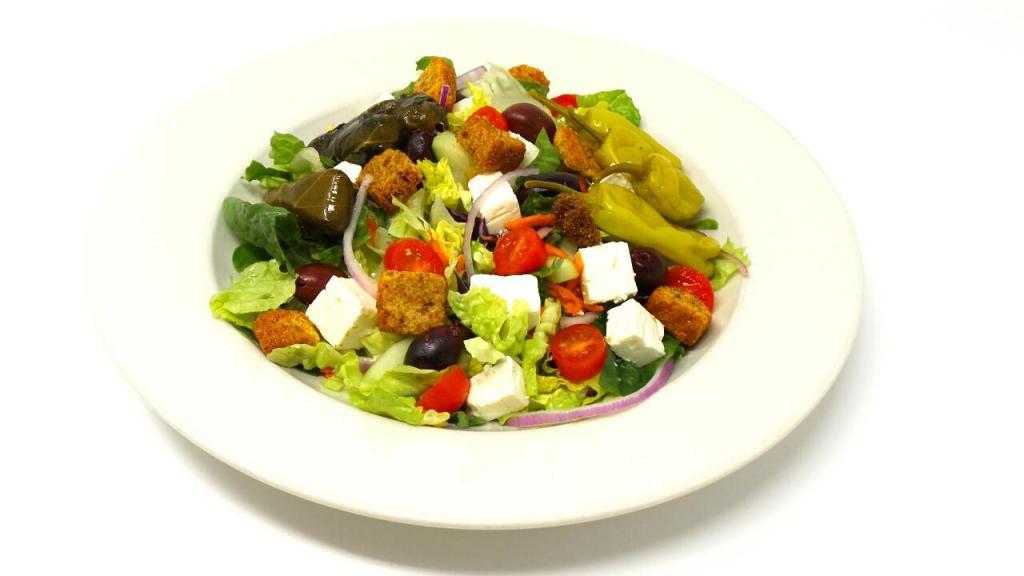 Greek Salad · Our house salad with feta, Kalamata olives, pepperoncini and stuffed grape leaves. small 1 dressing large 2 dressings