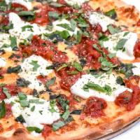 Nonna Pizza · Plum tomatoes, homemade fresh mozzarella, fresh garlic and fresh basil (no sauce).
