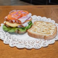 Gouda Gobbler Sandwich · Turkey, Gouda cheese, lettuce, tomato, red onion.