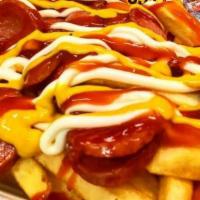 Salchipapas · Sliced, pan-fried beef sausages. Served with French fries and covered with mayonnaise, ketch...