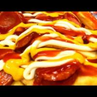 Salchicarne Monster · Beef tenderloin and hot dos pieces over crunchy french fries topped with mayonnaise, ketchup...