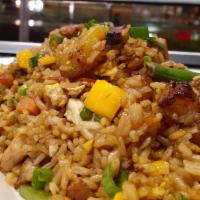 Chaufa Tropical · Peruvian fried rice sauteed with cubes of chicken, vegetables, sweet plantain, sesame oil, s...