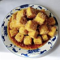 Sesame Tofu · Fried tofu with our signature spicy sesame sauce. Hot and spicy. Comes with fried rice and f...