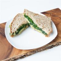 Avocado Egg Sandwich · Eggs, avocado, spinach and melted Swiss cheese. Served on toasted organic bread with a side ...