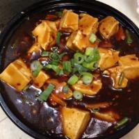 Ma Po Tofu · Bean curd. With steamed white rice. Spicy.