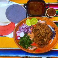 1 lb. of Birria · 1 lb. serves 2 adults... Includes cilantro, 6  tortillas, onion, limes, hot sauce, 16 oz of ...