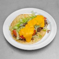 Cheeseburger  Taco · Beef, tomatoes, lettuce, onion, cheddar cheese sauce.