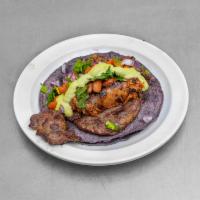 Lomito Tacomotora Style Taco · Ribeye Lomito ,Pinto beans, Mexican chorizo, avocado spicy sauce , onion ,cilantro.