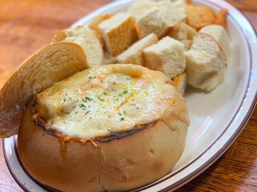 Shrimp and Crab Fondue · Fresh shrimp and lump crab meat in a delicious tomato and cream sauce, served in a bread bowl.