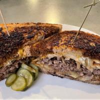 Patty Melt · House Ground Beef, Marbled Rye Bread, Caramelized Onion, Swiss Cheese, House Dressing. Serve...
