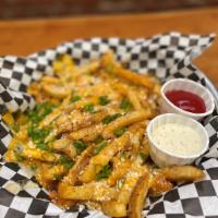 Cheese Fries · Nacho, Cheddar and Cotija Cheese, Scallions. Served with Garlic Aioli, Ketchup.