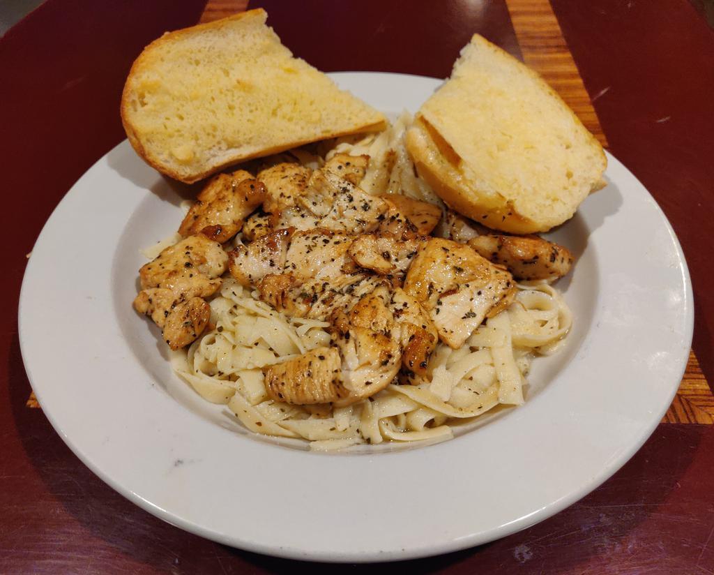 Chicken Piccata · Chicken breast sauteed in butter, capers, lemon juice and white wine. Served with garlic bread and your choice of soup or salad.