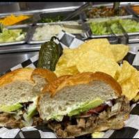 Carne Asada | Steak Torta · Standard Dressing: Refried Beans, Mayonnaise, Lettuce, Tomato and Avocado. Served with a sid...