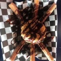 Fried ice-cream and churros · Light airy fried dough triangle pieces that are coated in cinnamon sugar and drizzled with v...
