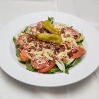 Large Italian Chopped Salad · Lettuce, tomato, cucumber, carrots, onion, pepperoni, bacon, mozzarella, romaine and peppero...
