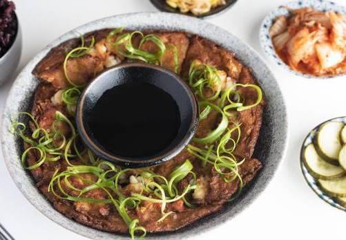Seafood pancake  · Shrimp, scallop and scallion stuffed pancake with seasoned soy dipping sauce. 