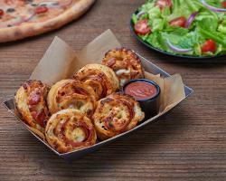 Pep Rollups · Housemade dough, 100% whole milk mozzarella and pepperoni. Sprinkled with Parmesan and serve...