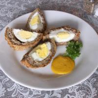 Scotch Egg · A protein packed treat great for breakfast, snack or with a salad. A hard boiled egg wrapped...