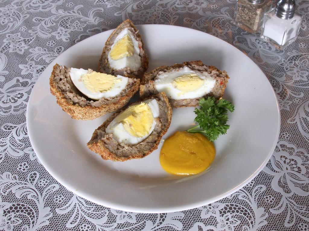 Scotch Egg · A protein packed treat great for breakfast, snack or with a salad. A hard boiled egg wrapped in sausage and lightly breaded.